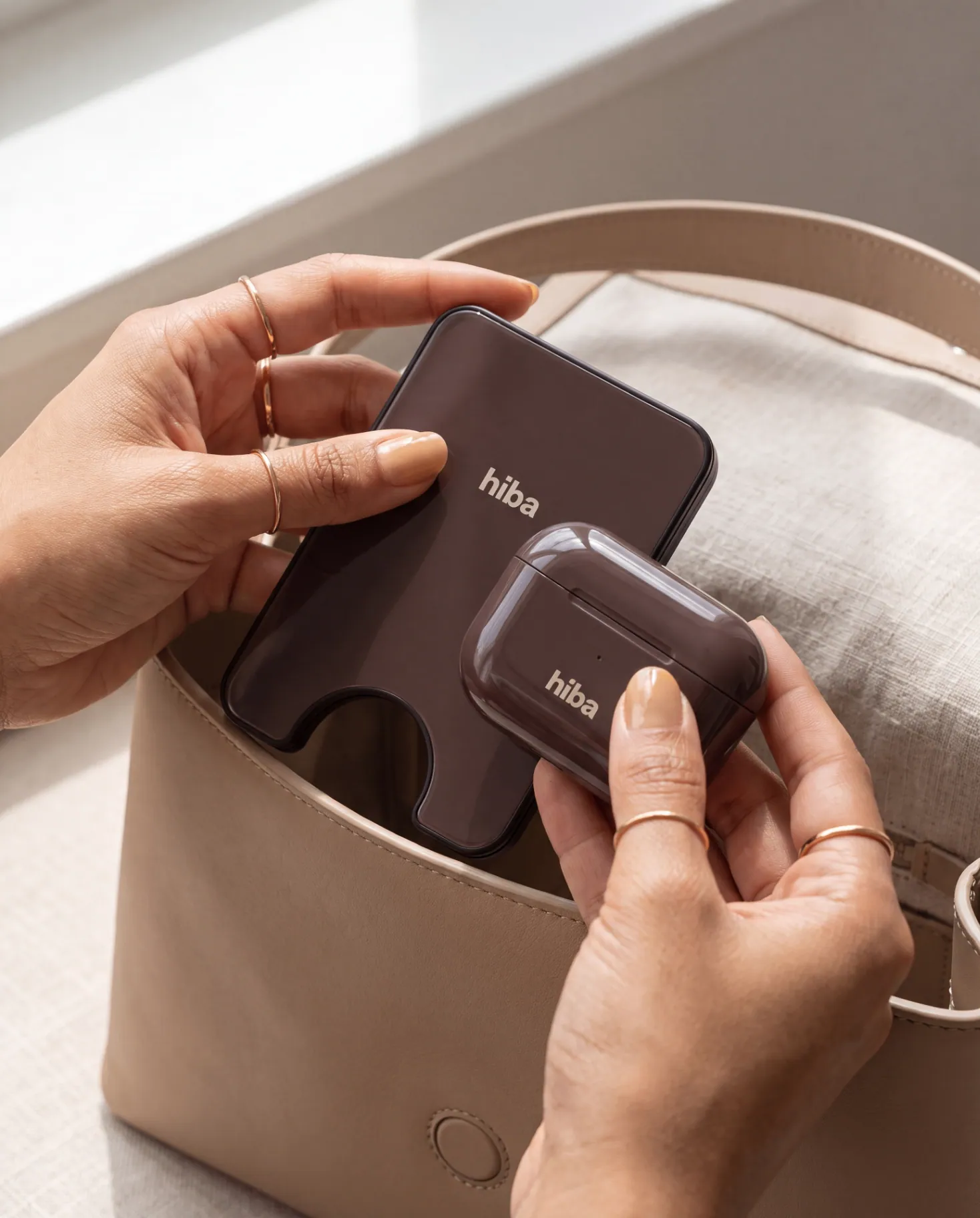 cardholder and wallet held in hand
